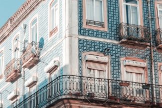 Lisbon's Healthy Buildings: Growing Demand for WELL and LEED Certification white and blue concrete building