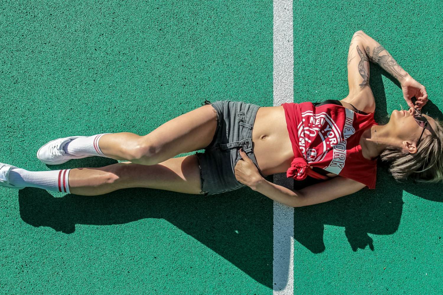 LEED woman lying on sports field