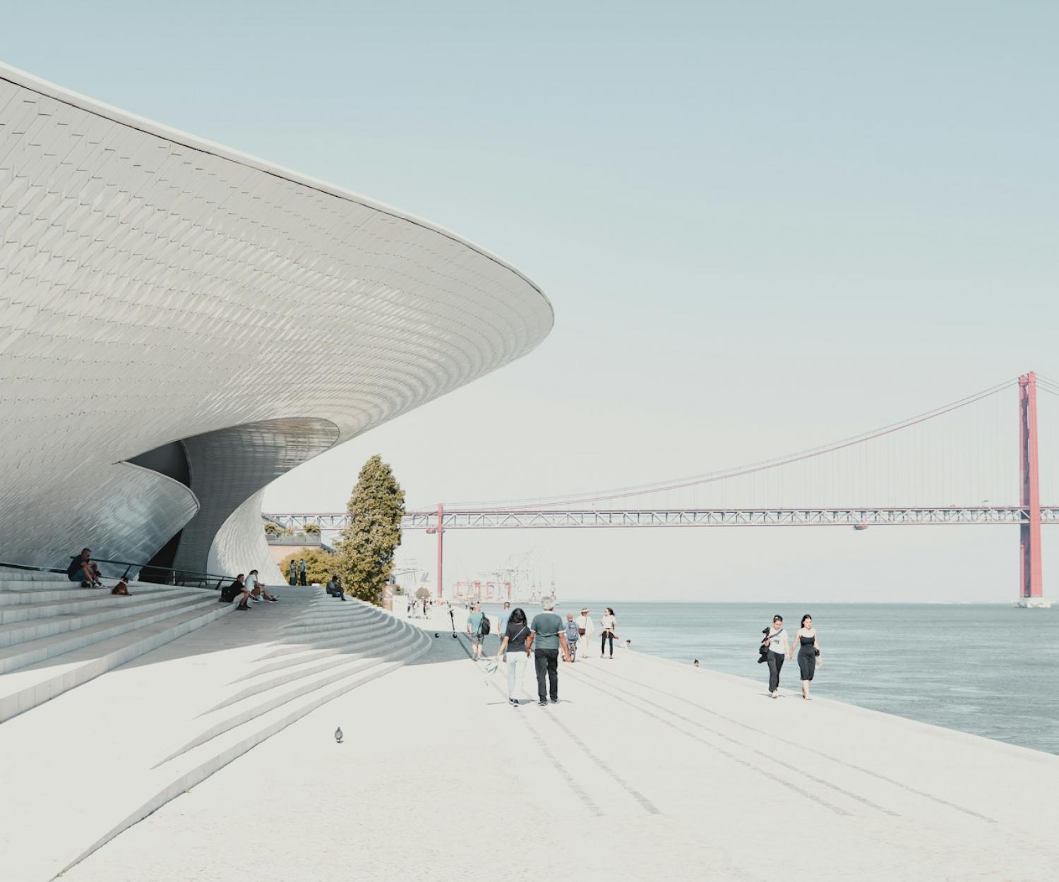 Healthy Buildings Lisbon people walking on beach during daytime