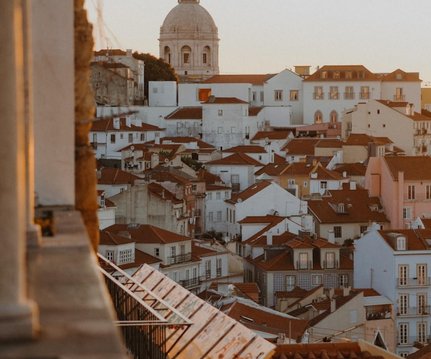 white and brown concrete building during daytime. Healthy Buildings Lisbon