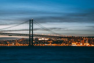 Healthy Buildings Lisbon: WELL & LEED Demand Drives Sustainable Real Estate concrete bridge at night time