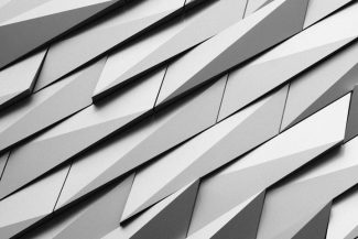 Abstract geometric pattern of angled metallic panels