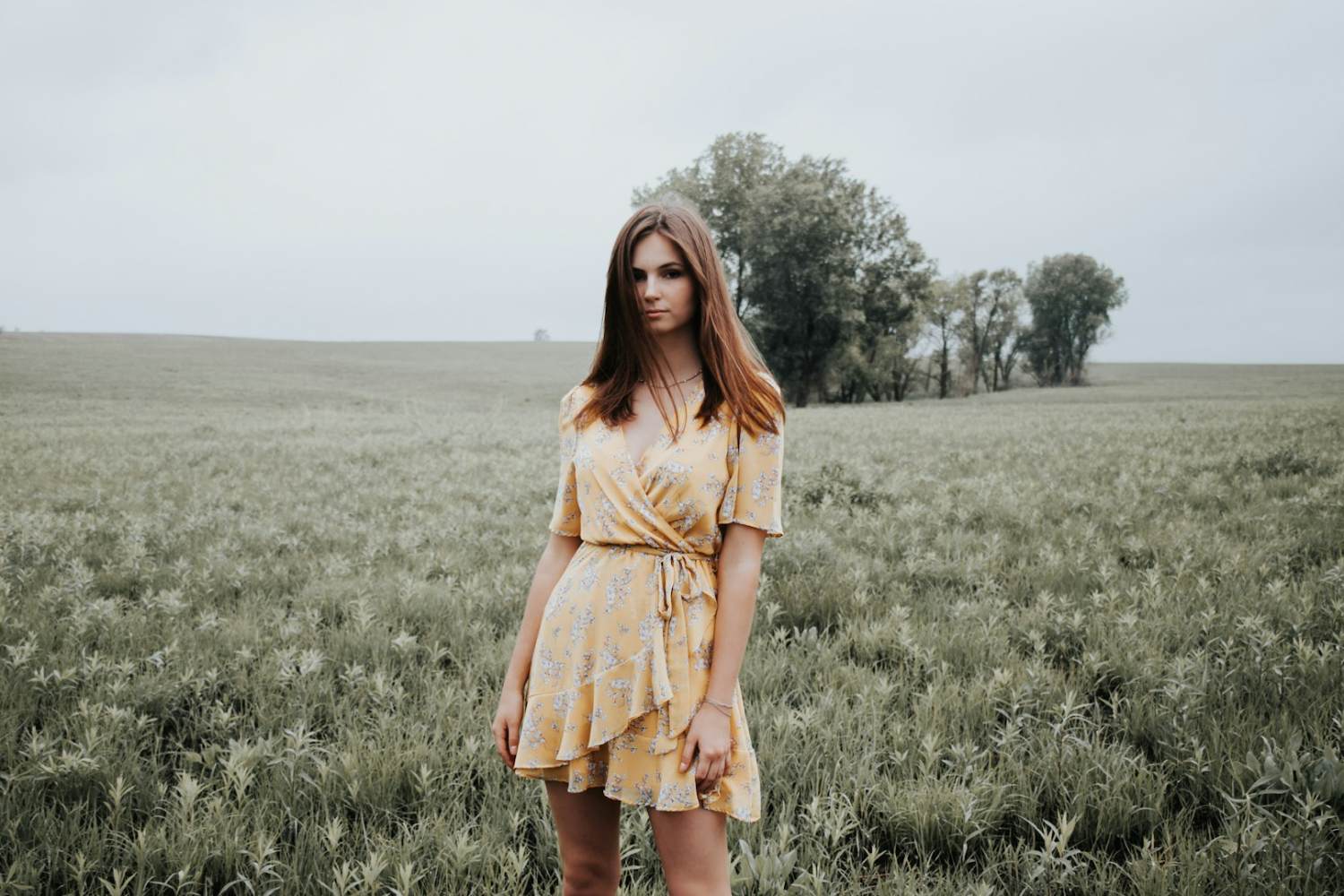 woman in yellow dress standing on green grass field during daytime. mezzalyn, Portugal, Lisbon, sustainable